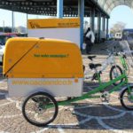 vélo équipé de bac de collecte pour huiles usagées