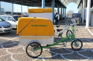 vélo équipé de bac de collecte pour huiles usagées